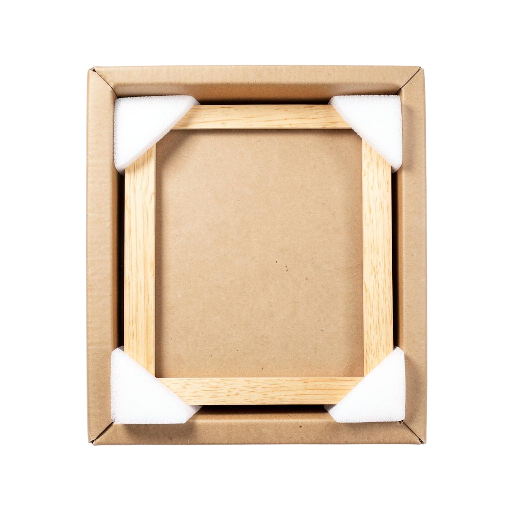 A flat picture frame box open with foam corner protectors fitted on all four corners of the frame